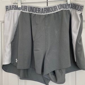 Gray and white Under Armour shorts.